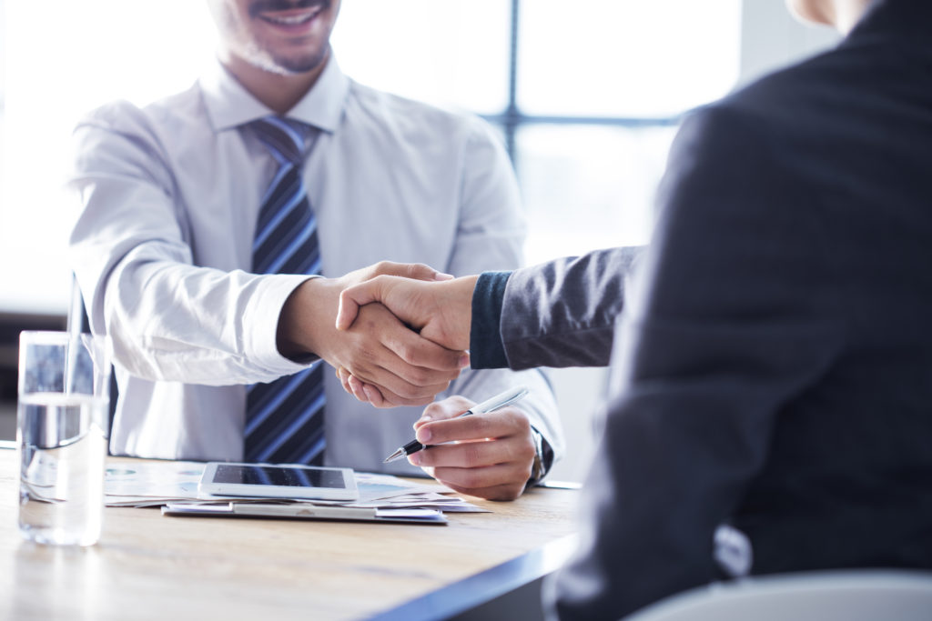 Business handshake in the office